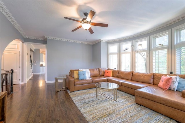 5701 W 148th Pl, Overland Park, KS 66223 - living area with ceiling fan, dark wood-type flooring, arched walkways, and ornamental molding