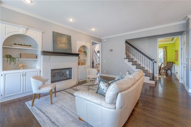 5701 W 148th Pl, Overland Park, KS 66223 - living room with stairs, dark wood-style flooring, a fireplace, built in features, and ornamental molding