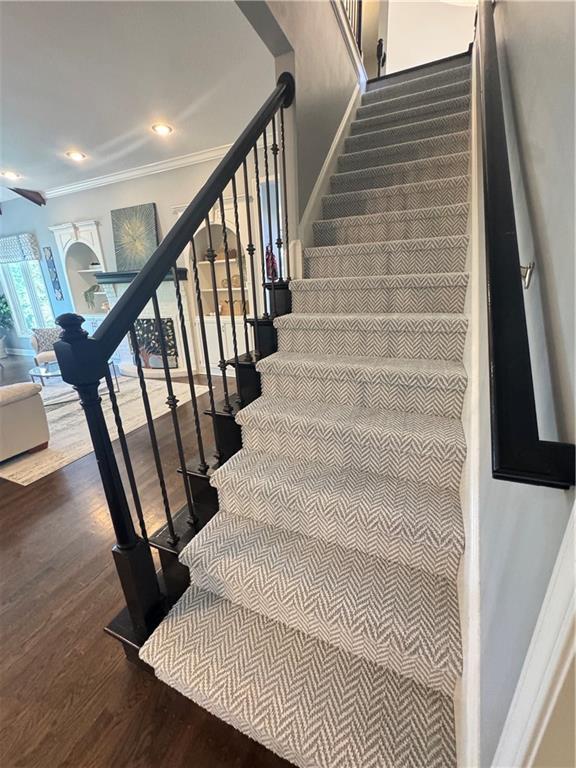 5701 W 148th Pl, Overland Park, KS 66223 - stairs with crown molding and wood finished floors