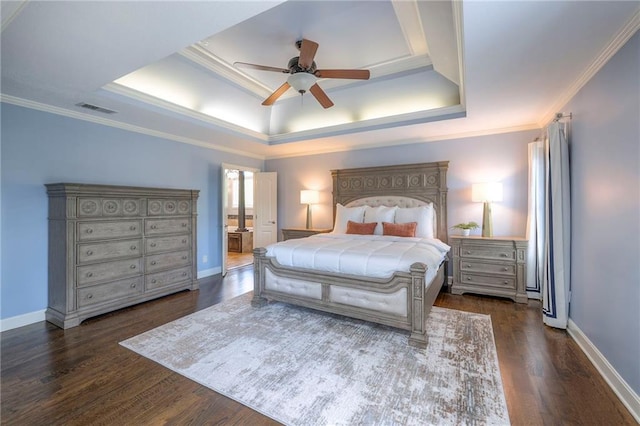5701 W 148th Pl, Overland Park, KS 66223 - bedroom with a tray ceiling, dark wood finished floors, crown molding, ceiling fan, and ensuite bath