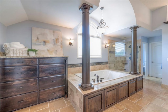 5701 W 148th Pl, Overland Park, KS 66223 - full bath featuring decorative columns, vaulted ceiling, a whirlpool tub, tiled shower, and stone tile flooring