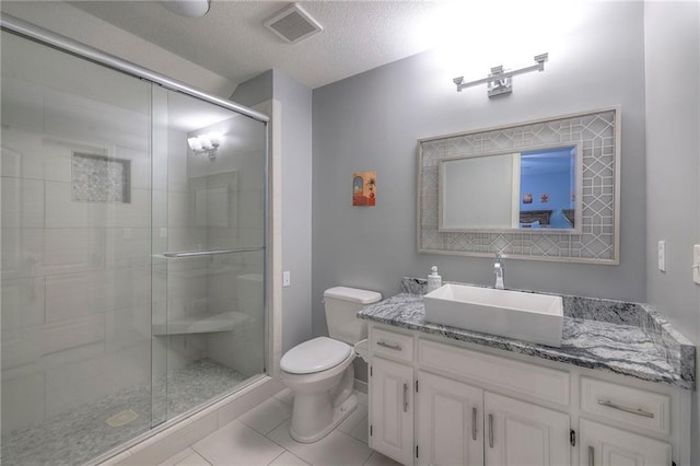 5701 W 148th Pl, Overland Park, KS 66223 - bathroom featuring vanity, a shower stall, tile patterned floors, and a textured ceiling