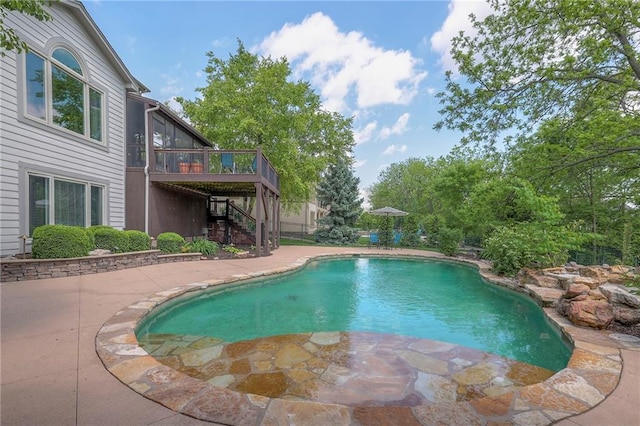 5701 W 148th Pl, Overland Park, KS 66223 - swimming pool with stairs, a wooden deck, and a patio area