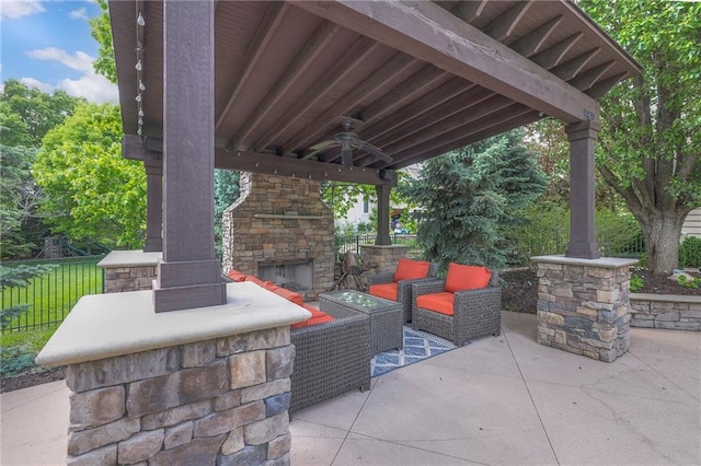 5701 W 148th Pl, Overland Park, KS 66223 - view of patio with ceiling fan and an outdoor living space with a fireplace