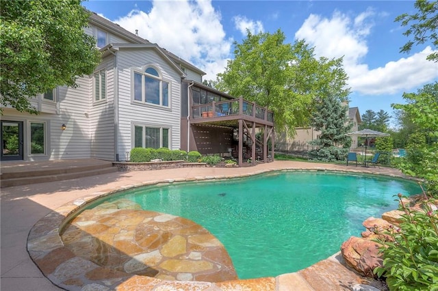5701 W 148th Pl, Overland Park, KS 66223 - view of swimming pool with a wooden deck, a patio area, and stairs
