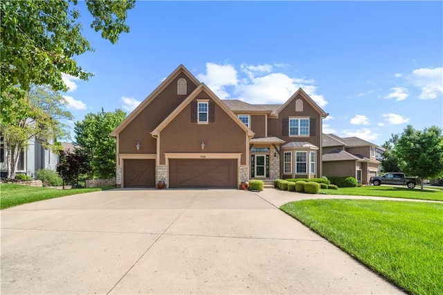 7406 W 145th Ter, Overland Park, KS 66223 - view of front of home featuring stucco siding, stone siding, an attached garage, a front yard, and driveway