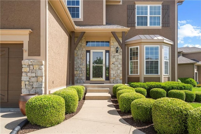 7406 W 145th Ter, Overland Park, KS 66223 - doorway to property with stone siding, stucco siding, and a garage