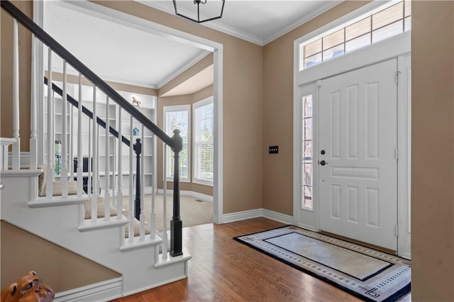 7406 W 145th Ter, Overland Park, KS 66223 - entryway featuring stairs, ornamental molding, wood finished floors, and baseboards