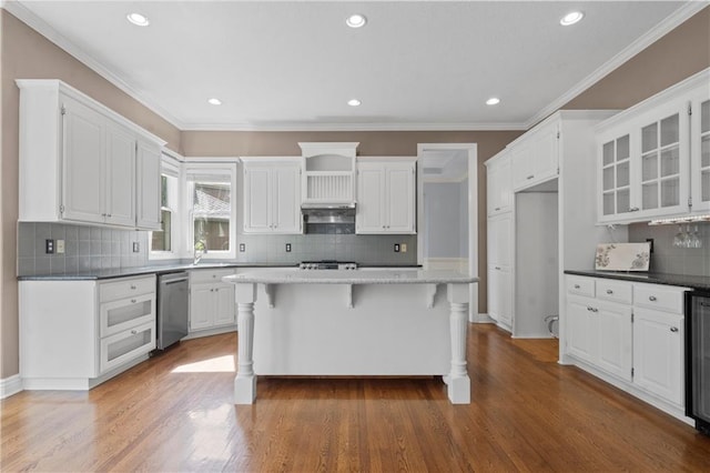 7406 W 145th Ter, Overland Park, KS 66223 - kitchen featuring stainless steel dishwasher, white cabinetry, a breakfast bar area, decorative backsplash, and recessed lighting