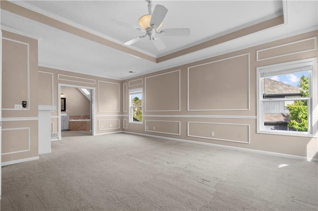 7406 W 145th Ter, Overland Park, KS 66223 - carpeted spare room featuring a decorative wall, ornamental molding, and a ceiling fan