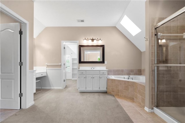 7406 W 145th Ter, Overland Park, KS 66223 - full bath with vaulted ceiling, a shower stall, vanity, a bath, and a skylight