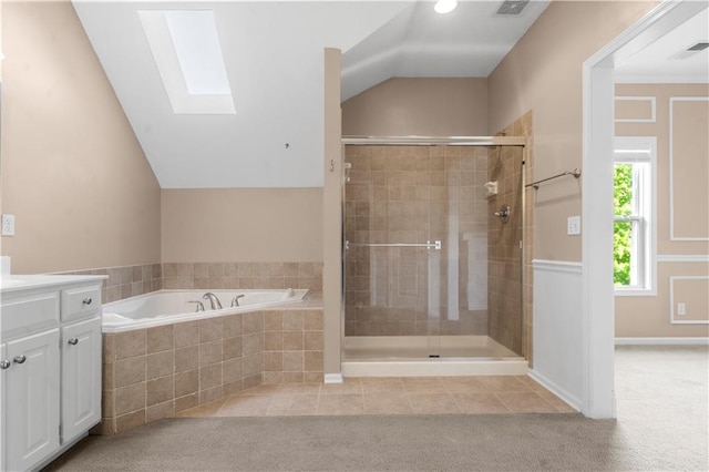 7406 W 145th Ter, Overland Park, KS 66223 - bathroom featuring a skylight, a shower stall, a bath, vanity, and lofted ceiling