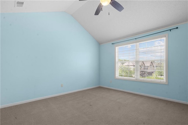 7406 W 145th Ter, Overland Park, KS 66223 - unfurnished room with vaulted ceiling, ceiling fan, light carpet, and baseboards