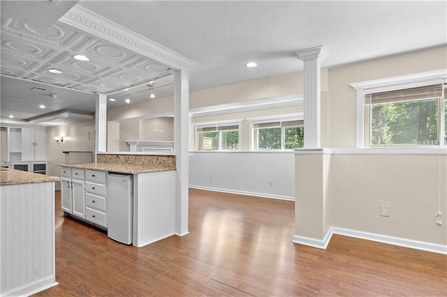 7406 W 145th Ter, Overland Park, KS 66223 - kitchen featuring dark wood-type flooring, white cabinetry, and baseboards