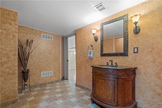 7406 W 145th Ter, Overland Park, KS 66223 - bathroom with vanity, baseboards, wallpapered walls, and stone finish floors
