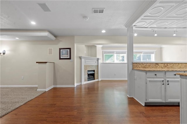 7406 W 145th Ter, Overland Park, KS 66223 - kitchen featuring baseboards, open floor plan, a fireplace, wood finished floors, and recessed lighting