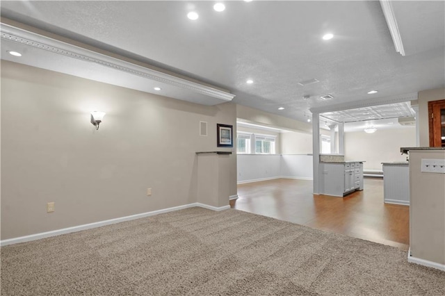 7406 W 145th Ter, Overland Park, KS 66223 - unfurnished living room featuring carpet, recessed lighting, baseboards, and bar area