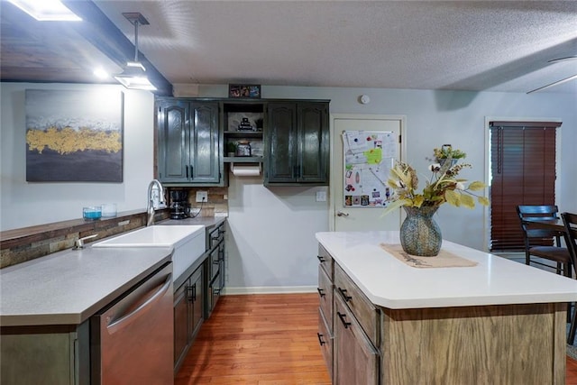 kitchen with stainless steel dishwasher, open shelves, a center island, a sink, and light wood finished floors