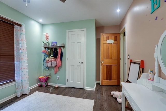 interior space featuring baseboards, recessed lighting, and dark wood-style floors