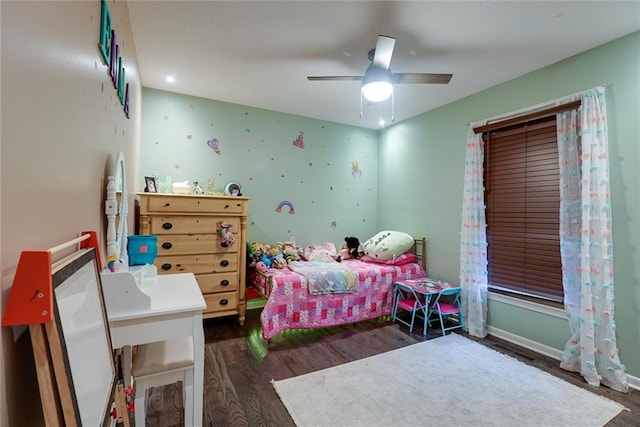 bedroom with ceiling fan and wood finished floors