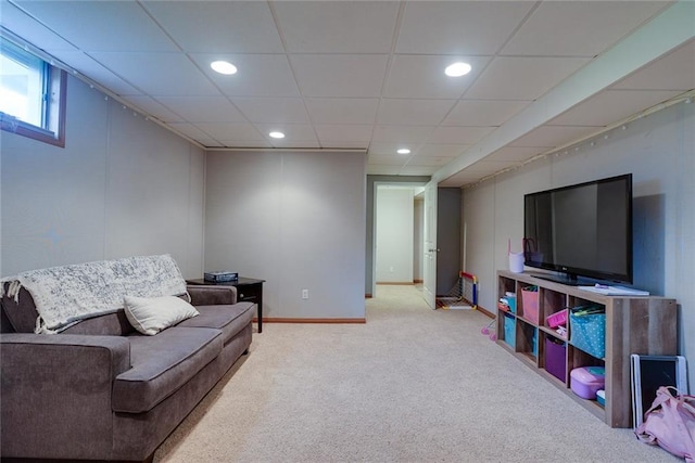 carpeted living area featuring recessed lighting and baseboards