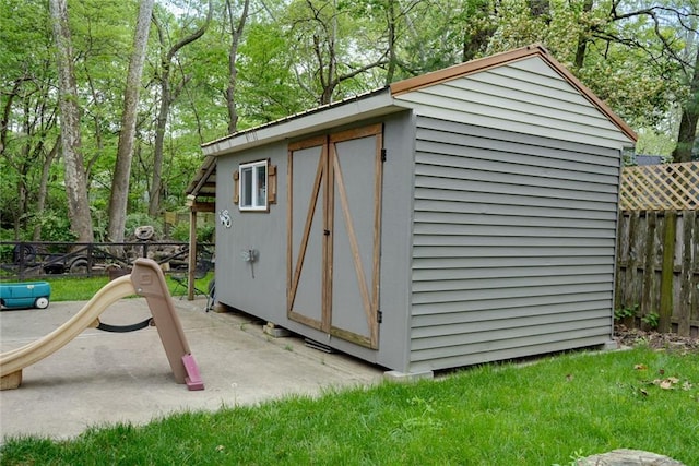 view of shed featuring a fenced backyard