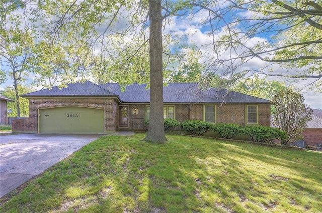 3913 Stonewall Ave, Independence, MO 64055 - single story home with concrete driveway, brick siding, an attached garage, and a front yard