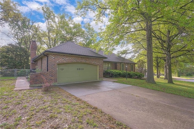 3913 Stonewall Ave, Independence, MO 64055 - view of property exterior featuring brick siding, an attached garage, fence, and a chimney