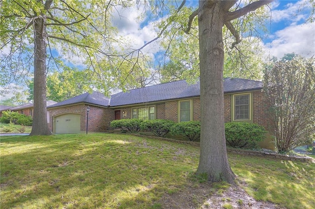 3913 Stonewall Ave, Independence, MO 64055 - single story home with brick siding, a front yard, and a garage