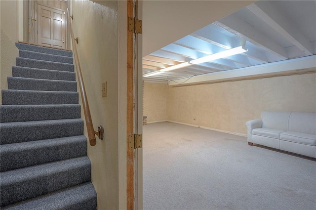 3913 Stonewall Ave, Independence, MO 64055 - finished below grade area featuring stairs, baseboards, and carpet