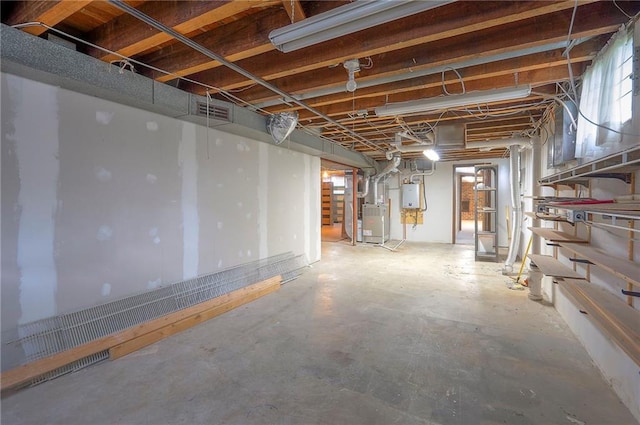 3913 Stonewall Ave, Independence, MO 64055 - unfinished basement featuring heating unit and visible vents