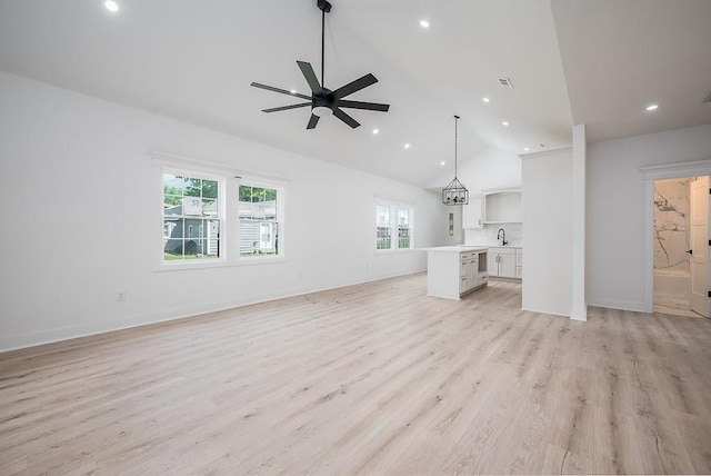 unfurnished living room with recessed lighting, a ceiling fan, and a wealth of natural light