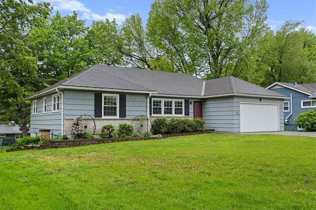 single story home featuring an attached garage, a front yard, and driveway