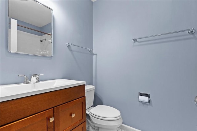 full bathroom featuring toilet, vanity, baseboards, tile patterned floors, and a shower