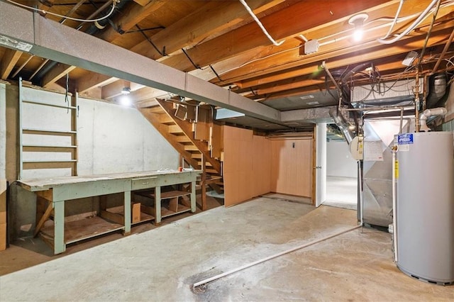 unfinished below grade area with gas water heater and stairway