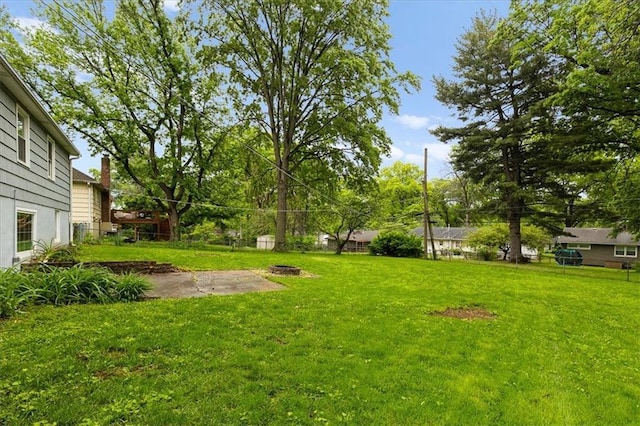 view of yard with a fire pit and a patio area