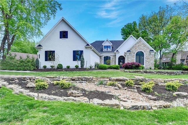 17045 S Highland Ridge Dr, Loch Lloyd, MO 64012 - view of front facade with stone siding, stucco siding, and a front lawn