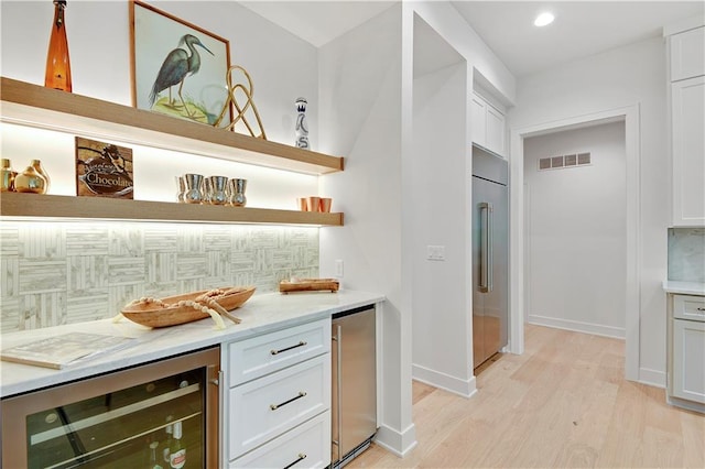 17045 S Highland Ridge Dr, Loch Lloyd, MO 64012 - indoor dry bar with beverage cooler, backsplash, high end fridge, refrigerator, and recessed lighting