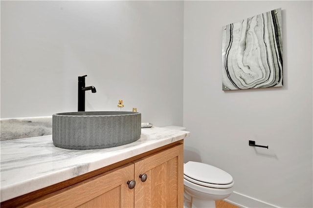 17045 S Highland Ridge Dr, Loch Lloyd, MO 64012 - bathroom featuring vanity, toilet, and baseboards