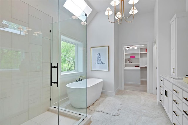 17045 S Highland Ridge Dr, Loch Lloyd, MO 64012 - full bathroom with a stall shower, a soaking tub, vanity, a spacious closet, and a chandelier