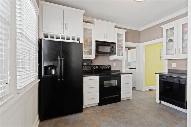 2717 Faraon St, Saint Joseph, MO 64501 - kitchen with black appliances, dark countertops, healthy amount of natural light, white cabinetry, and crown molding