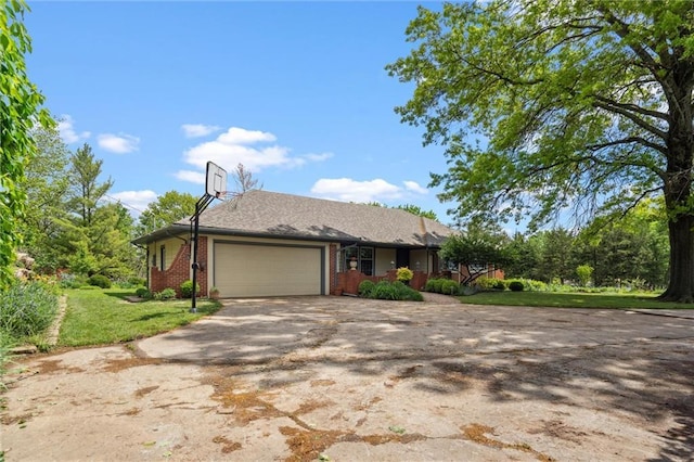 2106 Kasold Dr, Lawrence, KS 66047 - single story home featuring brick siding, driveway, a front lawn, and a garage