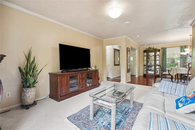 2106 Kasold Dr, Lawrence, KS 66047 - living area featuring baseboards, ornamental molding, carpet, and visible vents