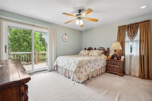 2106 Kasold Dr, Lawrence, KS 66047 - bedroom with carpet flooring, access to outside, a ceiling fan, and multiple windows