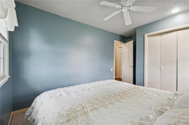 2106 Kasold Dr, Lawrence, KS 66047 - bedroom featuring visible vents, a ceiling fan, baseboards, and a closet