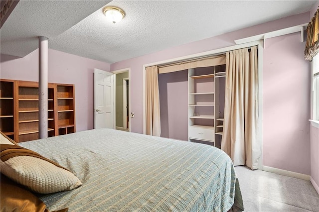 2106 Kasold Dr, Lawrence, KS 66047 - bedroom featuring baseboards and a textured ceiling