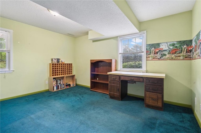2106 Kasold Dr, Lawrence, KS 66047 - unfurnished office featuring carpet flooring, a textured ceiling, and baseboards