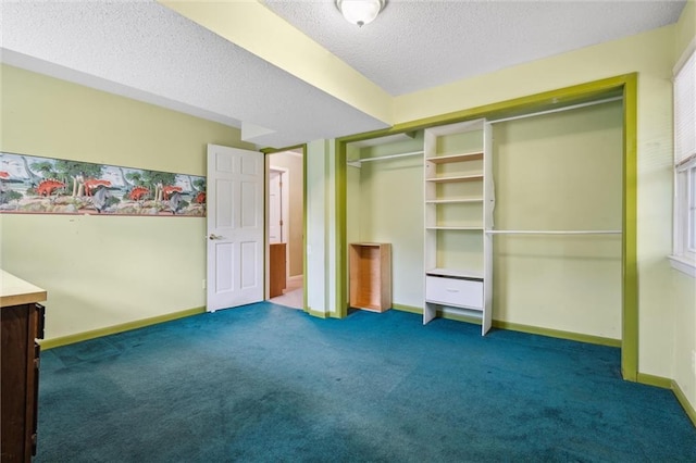 2106 Kasold Dr, Lawrence, KS 66047 - unfurnished bedroom featuring carpet floors, a textured ceiling, baseboards, and a closet
