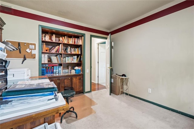 2106 Kasold Dr, Lawrence, KS 66047 - office area featuring visible vents, ornamental molding, baseboards, and light carpet