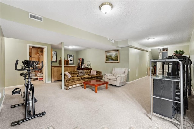 2106 Kasold Dr, Lawrence, KS 66047 - workout area featuring baseboards, carpet flooring, a textured ceiling, and visible vents